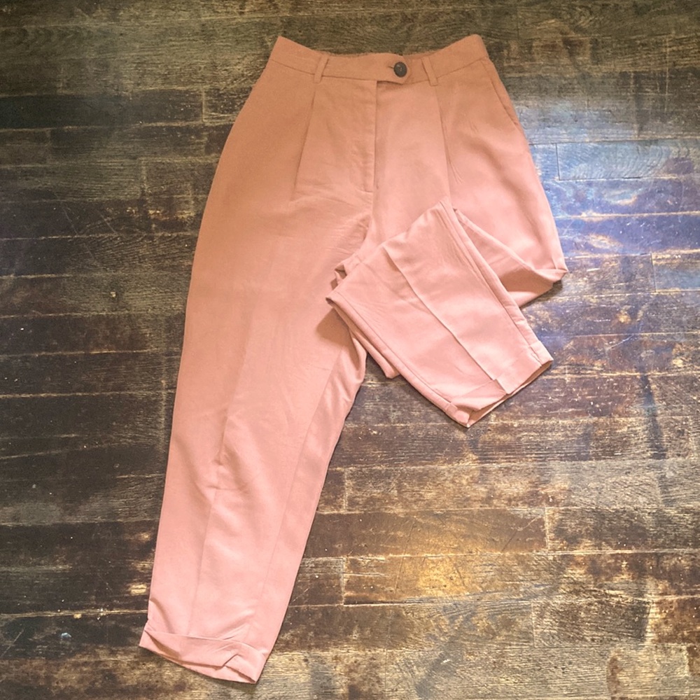 Pink light pantsuit from Mango.